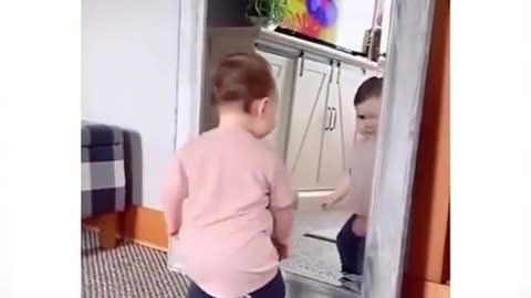 "Adorable Baby's Mirror Dance Party: Cutest Reaction Ever!"