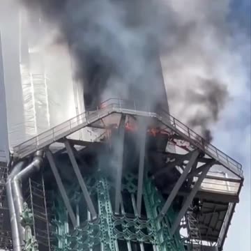 Spire Of Famous French Cathedral On Fire