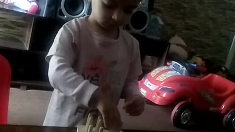 Cute girl playing intelligently and cute manner