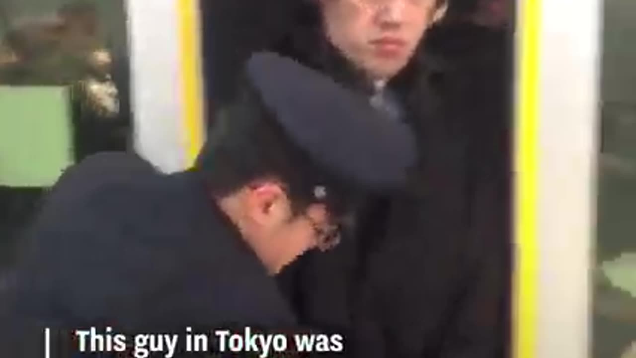 Guy Squeezes Onto Tokyo Subway