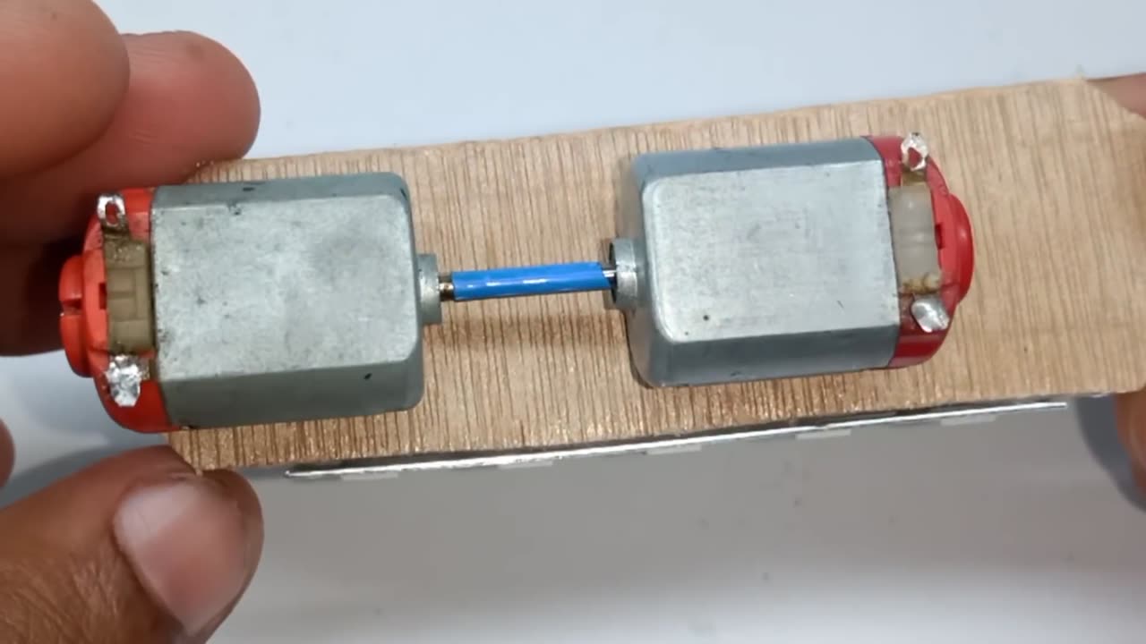 Free energy generator with two dc motor