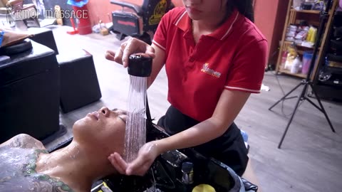 A man with tattoos all over his body experienced a barber shop massage