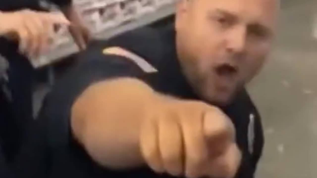 Usual suspect under arrest wants to bite police officer who reacts with a punch.