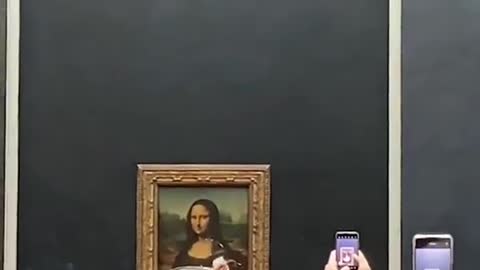 Man smears cake on Mona Lisa painting in the name of climate change