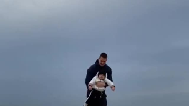 Father Flips Toddler in Air and Catches Her Back