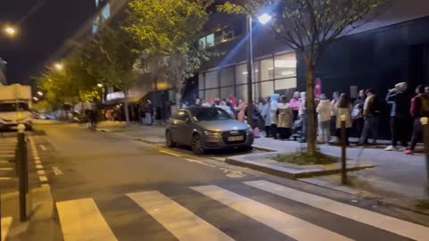 Footage shows hundreds of people waiting in queue for food distribution in French capital Paris