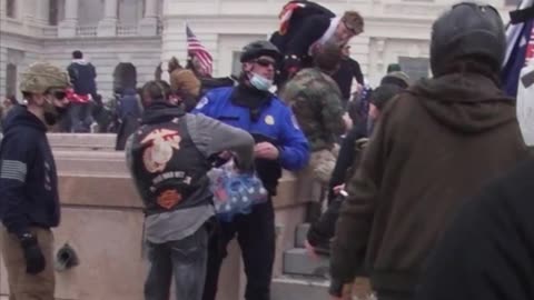 Cops handing out refreshments to "insurrectionists"**