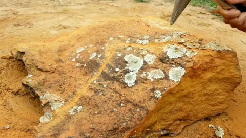 Carving a "R" into a ladscape stone - Timelapse