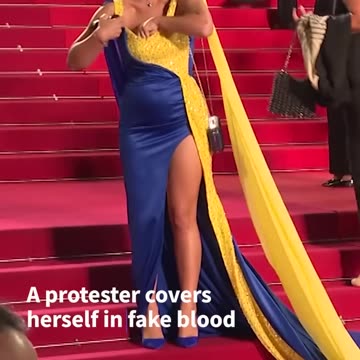 Protester pours fake blood on herself at Cannes Film Festival _ AFP #shorts