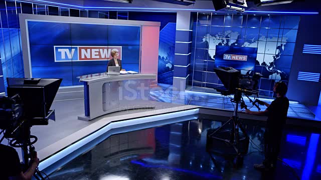 News studio with the anchorwoman presenting the news stock video