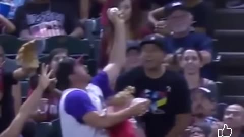 Guy lets go of kid to catch ball