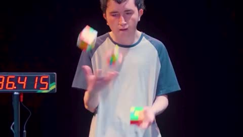 Solving Three Cubes Whilst Juggling - Guinness World Records