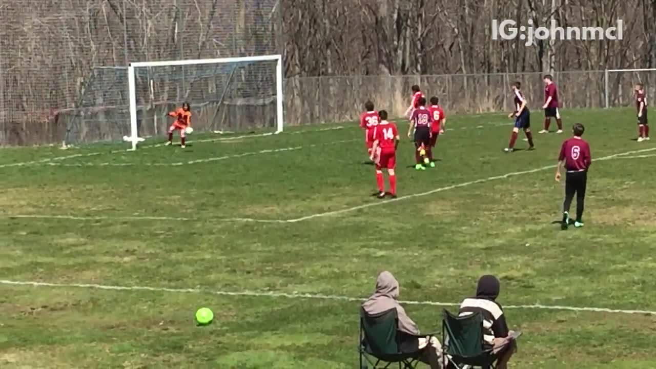 Orange goalie kid misses soccer block through legs