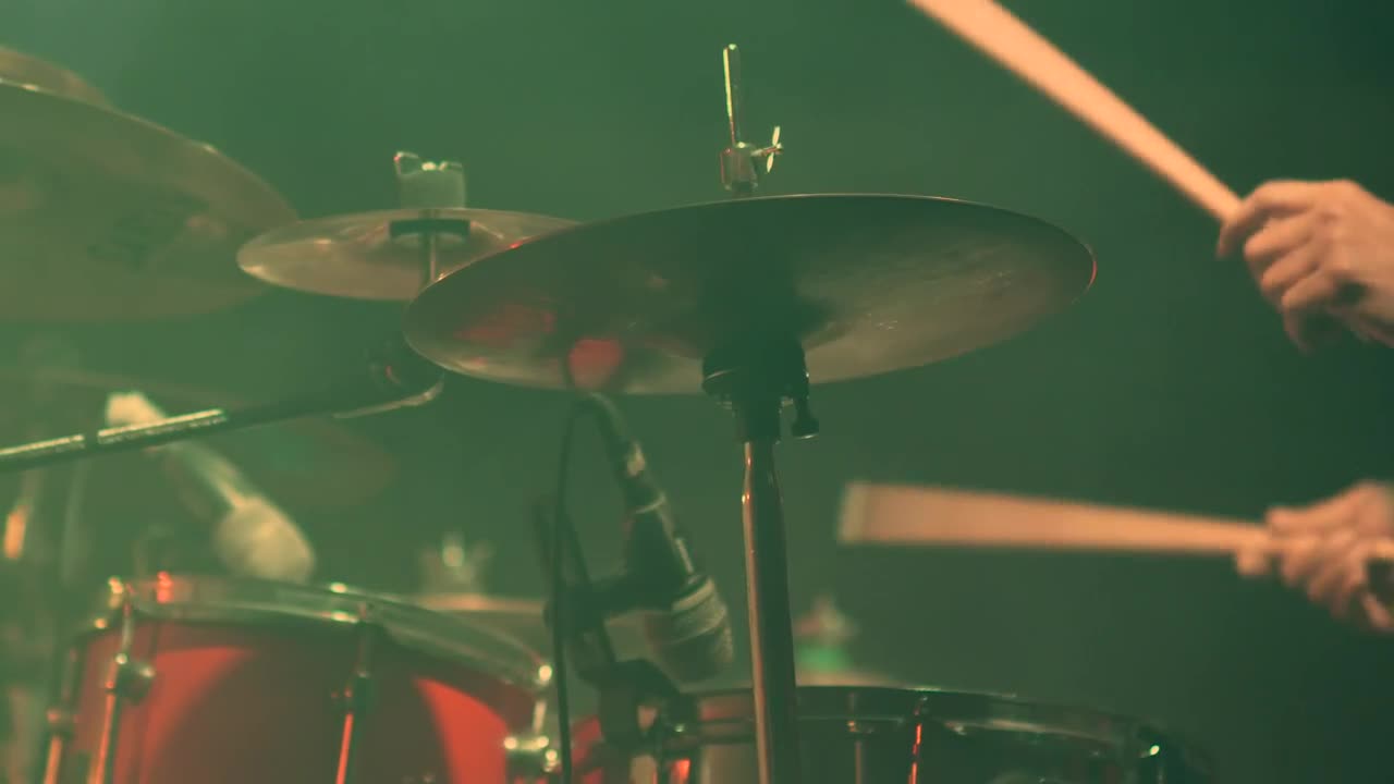 Musician playing drums on stage