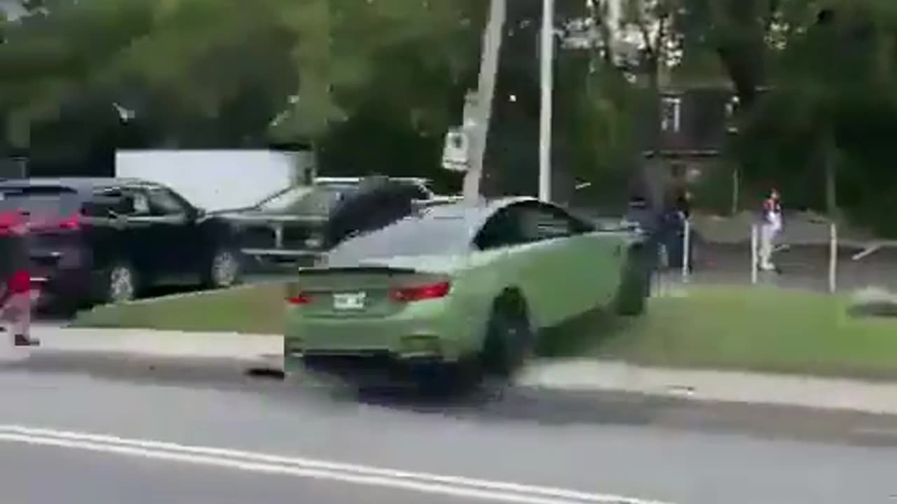 Stupid Driver Showing Off In A BMW Nearly Gets A Couple Of Pedestrians Killed