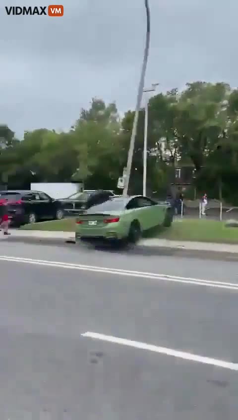Stupid Driver Showing Off In A BMW Nearly Gets A Couple Of Pedestrians Killed