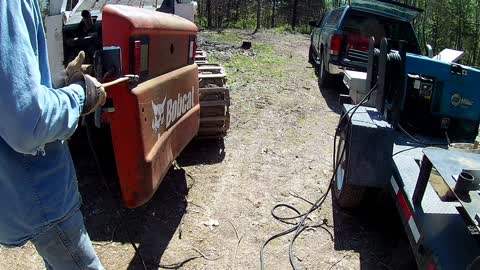 Welding a lock latch on the skid steer