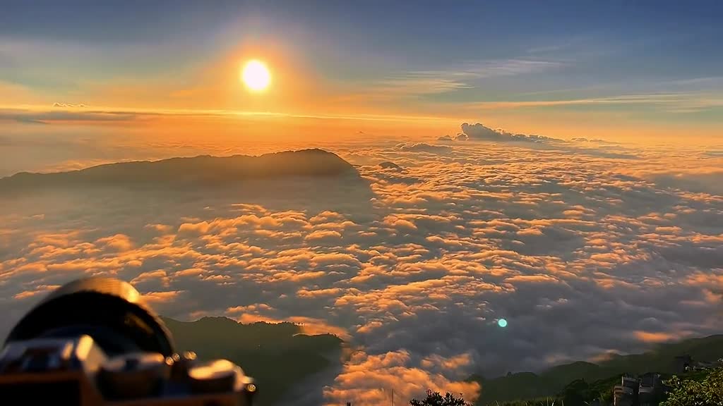 The mountains rose above a swathe of thick cloud.