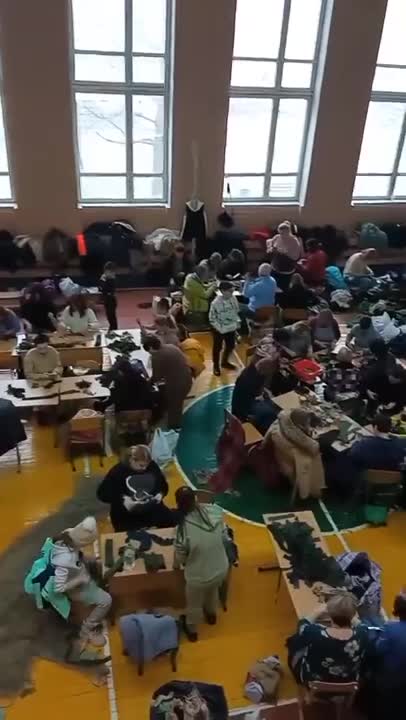 Children, instead of going outside, are forced to knit camouflage nets.