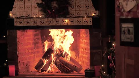 A fireplace lit at christmas time