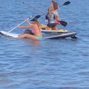Three women clueless paddle boarding
