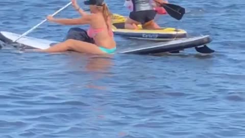 Three women clueless paddle boarding