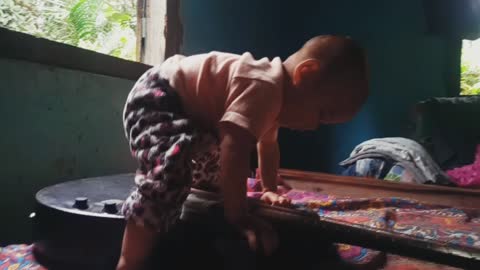 Baby playing guitar