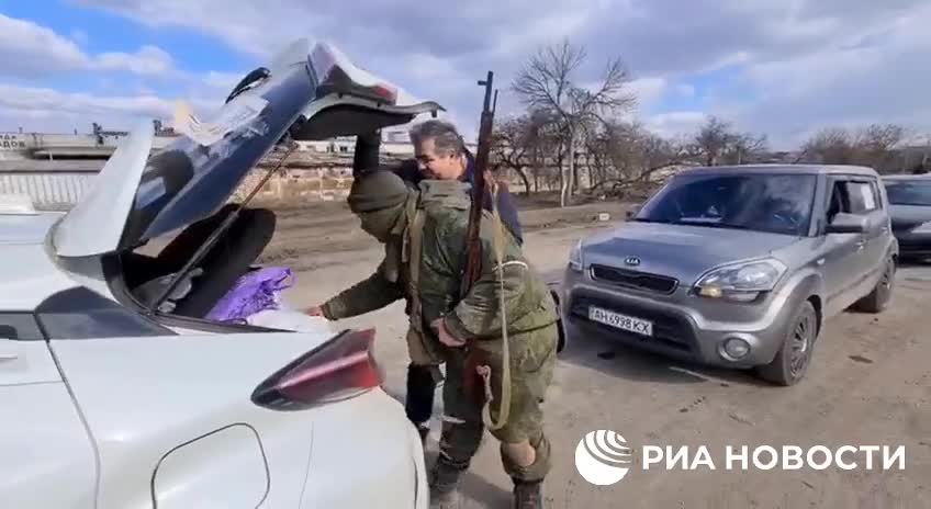 The DPR military checks men leaving Mariupol for signs of participation in the battles.