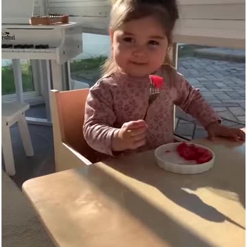 Alara preparing her snack in her little kitchen!🍉