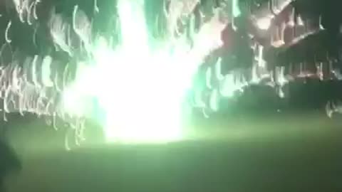 Guys popping green fireworks randomly