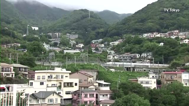 Japan's landslide rescue, with about 80 missing