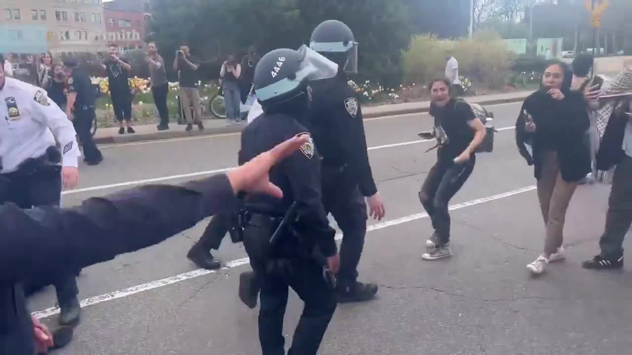 NYPD putting Palestinian protesters on the pavement.