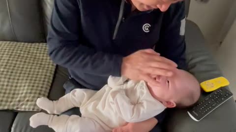 Cute baby and her grandfather