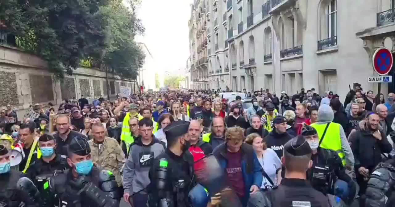 French Police Walk in front of Protesters During Lockdown Protests