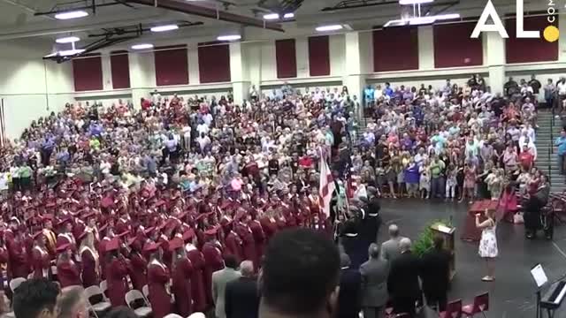 Her mic cuts out during the Nation Anthem the crowd sing the rest.