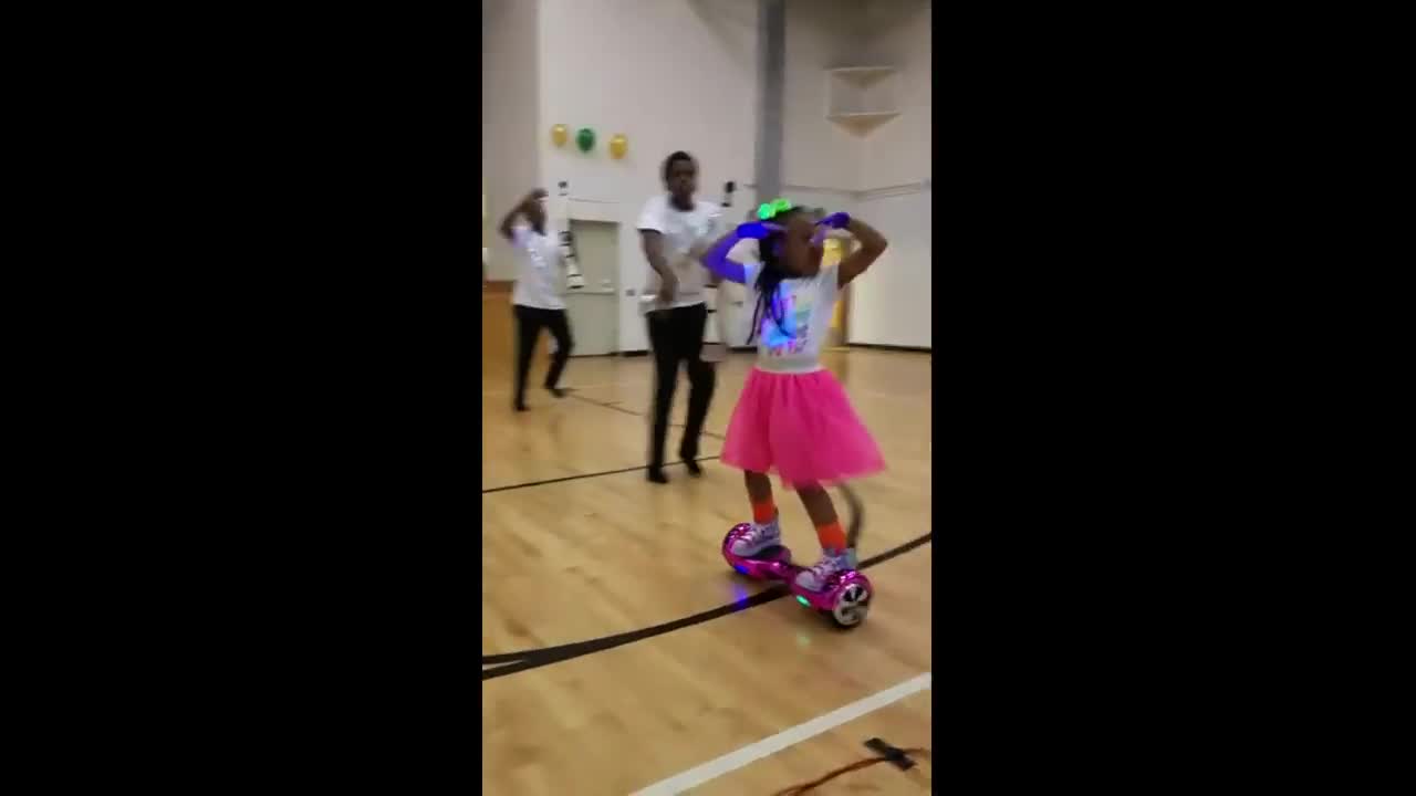 talented Little girl shows off hoverboard dance moves