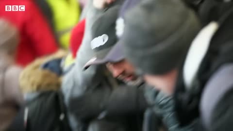 Crowds of women and children board trains out of Ukraine