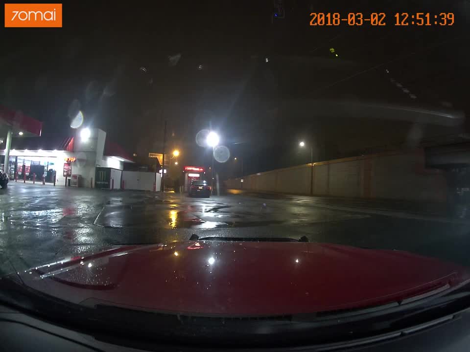 Red Light Runner Nearly Causes Accident on Wet Roads