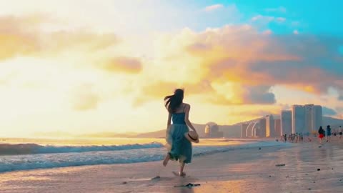 The back of the beautiful woman in the sunset, running with wind