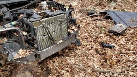 Abandoned wrecked Jeep Grand Cherokee on the trails