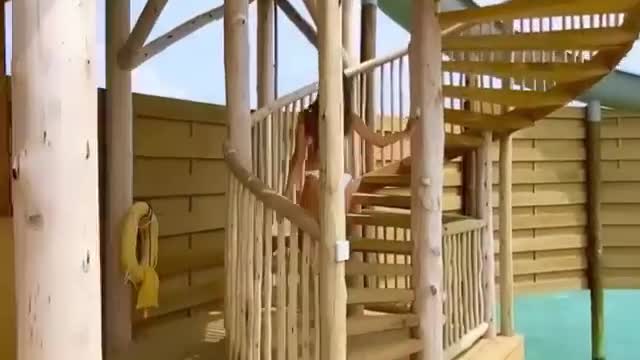 Just after swimming, she ran to play the fun slide.