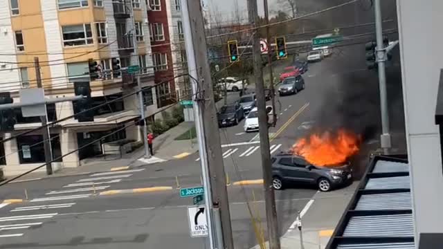 Guy stabs himself, sets his car on fire and urinates (hands free style) in Seattle