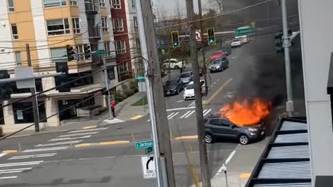 Guy stabs himself, sets his car on fire and urinates (hands free style) in Seattle