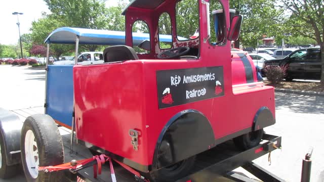 Lawn Mower Train On A Trailer Parked Beside The Lawn Mowers At Lowe's