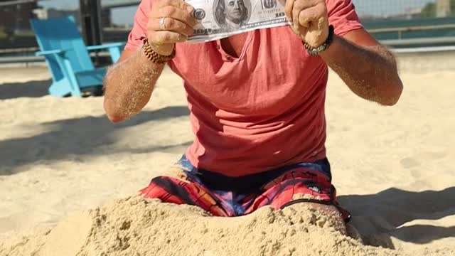 A man Found Money in Beach