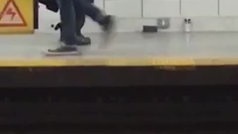 Black trenchcoat guy tap dances in subway