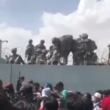Babies Being Pulled Over Walls by U.S. Soldiers in Afghanistan
