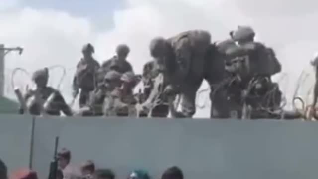 Babies Being Pulled Over Walls by U.S. Soldiers in Afghanistan
