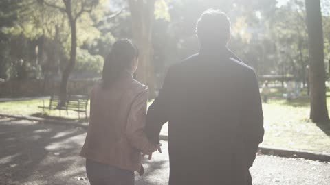 Couple Walking on Park