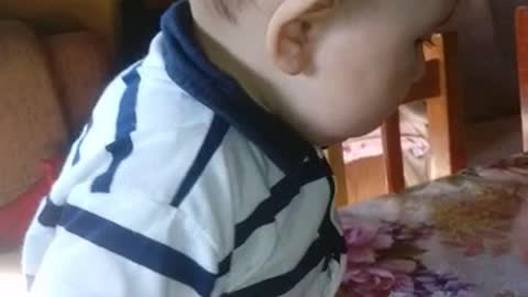 baby eating orange for the first time